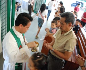 Priest serving Mass in Missions